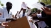 A group of Zimbabwean doctors sing as they protest at Parirenyatwa hospital in Harare, Zimbabwe, Sept. 15, 2019. 