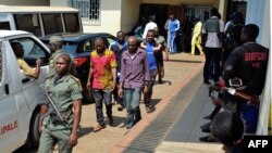 Men arrested in connection with Cameroon's anglophone crisis are seen at the military court in Yaounde, Cameroon, Dec. 14, 2018.