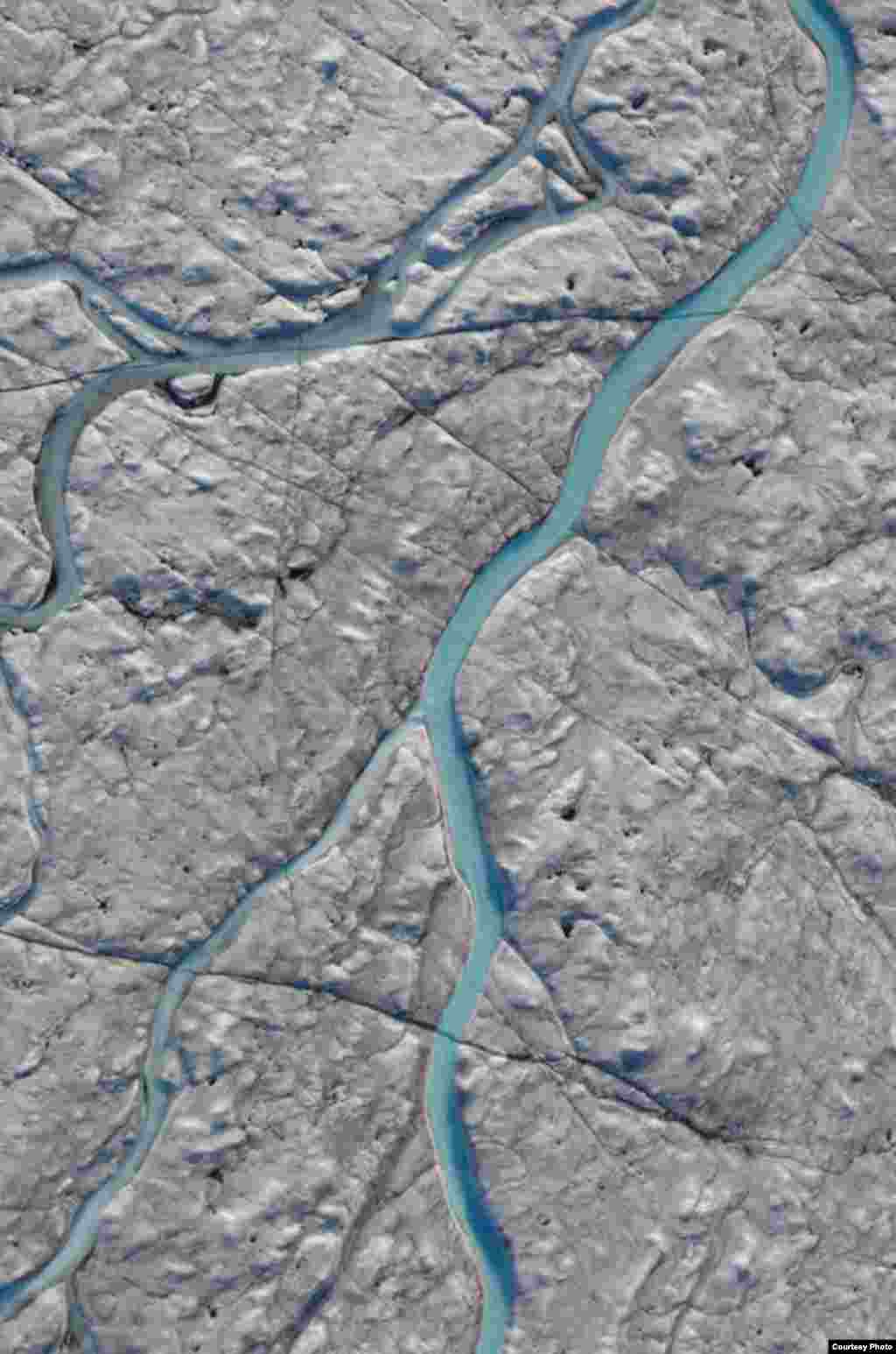 When snow and ice melt during the summer months, waterways like this one form an intricate drainage system that captures virtually all surface runoff. (UCLA/Laurence C. Smith)