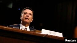 FILE - Former FBI director James Comey testifies before a Senate Intelligence Committee hearing on Capitol Hill in Washington, June 8, 2017.