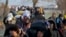 Migrants walk to reach Pazarakule border gate, Edirne, Turkey, at the Turkish-Greek border on Sunday, March 1, 2020. 