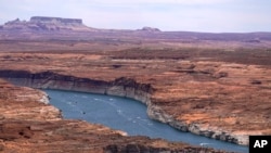 Low water levels at Wahweap Bay at Lake Powell along the Upper Colorado River Basin are shown Wednesday, June 9, 2021, at the Utah and Arizona border at Wahweap, Ariz. (AP/Ross D. Franklin)