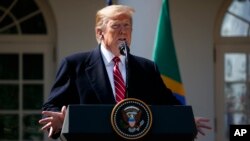 President Donald Trump speaks during a news conference with Brazilian President Jair Bolsonaro in the Rose Garden of the White House, Tuesday, March 19, 2019, in Washington.