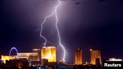 Lightning strikes behind Las Vegas Strip casinos as a thunderstorm passes through Las Vegas, Nevada, U.S. September 13, 2017. 