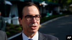 FILE - Treasury Secretary Steve Mnuchin talks with reporters about trade with China outside the White House, May 21, 2018, in Washington. 