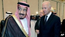 FILE - In this Oct. 27, 2011, photo, then-U.S. Vice President Joe Biden offers his condolences to then-Prince Salman bin Abdel-Aziz upon the death of his brother, Saudi Crown Prince Sultan bin Abdul-Aziz Al Saud, in Riyadh.