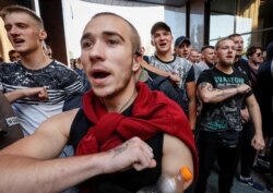 Activists of Ukrainian nationalist groups protest a court decision to release on bail Volodymyr Tsemakh, suspected of involvement in the downing of the Malaysia Airlines Flight MH17 in 2014, in Kyiv, Ukraine, Sept. 5, 2019.