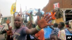 In the final week before Congo's elections, campaign trucks - like this one for the ruling party that at one time enjoyed immense popularity in the east - drive down the dirt roads of the North Kivu regional capital, Goma, November 2011.
