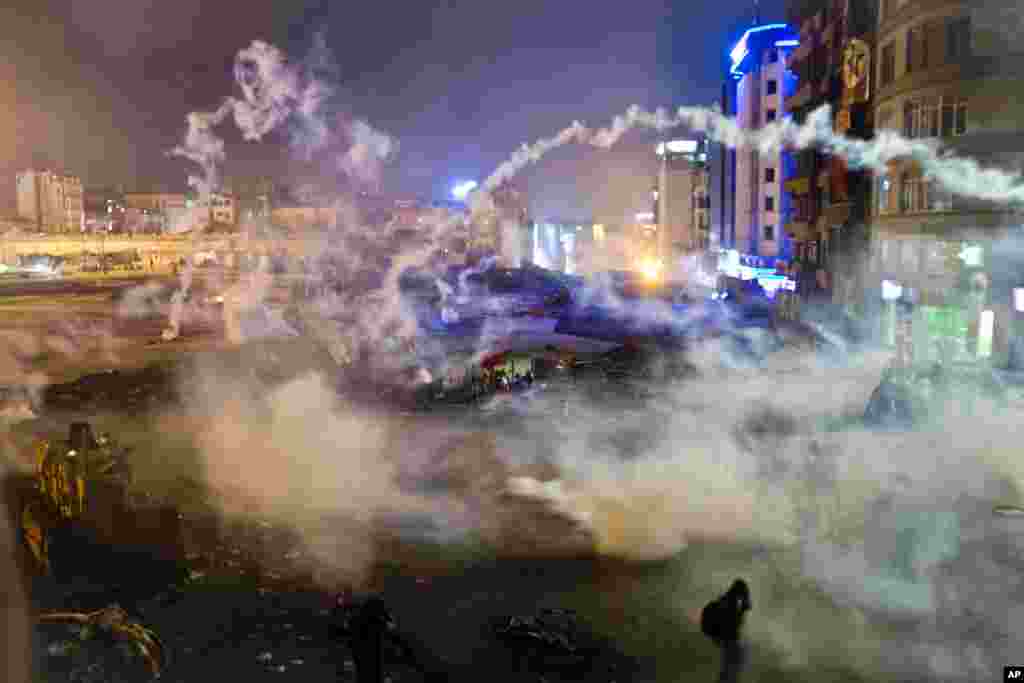 Taksim Square is flooded by tear gas during clashes between protesters and riot police, Istanbul, June 11, 2013. 