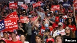 Supporters of U.S. President Donald Trump cheer at the start of his first re-election campaign rally in several months in the midst of the coronavirus disease (COVID-19) outbreak, at the BOK Center in Tulsa, Oklahoma, U.S., June 20, 2020.