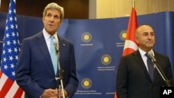 Turkey's Minister of Foreign Affairs Mevlut Cavusoglu, right, and U.S. Secretary of State John Kerry speak to the media before a meeting in Ankara, Sept. 12, 2014.