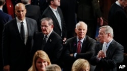 From left to right: Sen. Cory Booker, D-N.J., Sen. Robert Menendez, D-N.J., Sen. Ben Cardin, D-Md., and Sen. Richard Durbin, D-Ill., wait for the arrival of President Donald Trump to deliver his State of the Union address to a joint session of Congress, Jan. 30, 2018. 