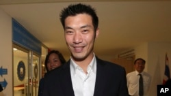 The leader of the new political party named Future Forward party, Thanathorn Juangroongruangkit arrives at the Technology Crime Suppression Division to hear police charges in Bangkok, Thailand, Sept. 17, 2018. 