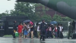 In Manila, Flights Depart with Typhoon Aid, Return With Survivors