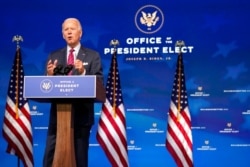 FILE - President-elect Joe Biden speaks at The Queen theater, in Wilmington, Delaware, Dec. 4, 2020.