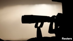 A Turkish soldier watches the Turkish-Syrian border near the southeastern town of Suruc, Sept. 24, 2014.