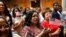 FILE - New citizens stand during a U.S. Citizenship and Immigration Services (USCIS) naturalization ceremony at the New York Public Library in Manhattan, New York, July 3, 2018. 