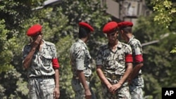 Egyptian protesters shout anti-Israeli slogans in front of military vehicle near the Israeli embassy in Cairo, August 20, 2011, as they protest the deaths of Egyptian security forces killed in a shootout between Israeli soldiers and Palestinian militants 