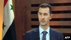A grab from Addounia pro-regime Syrian TV shows Syrian President Bashar al-Assad speaking during an excerpt of an interview in Damascus, August 29, 2012.