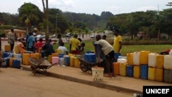 FILE - Residents of Cameroon's capital Yaounde often queue for hours to fill jerry cans with water during periods of severe shortages. (UNICEF)