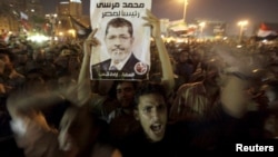 Supporter of President Morsi during celebration of his dismissal of former defense ministers, Tahrir Square, Cairo, Aug. 13, 2012.