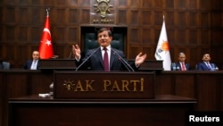 Turkish Prime Minister Ahmet Davutoglu addresses lawmakers from his ruling AK Party (AKP) at the Turkish parliament in Ankara January 6, 2015.
