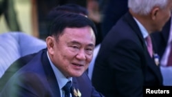 ထိုင်းဝန်ကြီးချုပ်ဟောင်းလည်းဖြစ်၊ လက်ရှိထိုင်းဝန်ကြီးချုပ်ရဲ့ဖခင်လည်းဖြစ်တဲ့ Thaksin Shinawatra (ယခင်မှတ်တမ်းဓာတ်ပုံ)