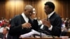 Advocate Dali Mpofu (L) reacts as he chats to Advocate Tembeka Ngcukaitobi during court hearing arguments on a report into allegations of political interference by wealthy friends of President Jacob Zuma, at the North Gauteng High Court, in Pretoria, South Africa. November 2, 2016. 