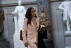 Rep. Alexandria Ocasio-Cortez, D-N.Y., walks Capitol Hill in Washington, March 27, 2020.
