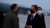 U.S. Secretary of State Antony Blinken talks with Lieutenant General Scott Pleus, the deputy commander of United States Forces Korea, before he boards a plane at the Osan Air Base in Pyeongtaek, South Korea, Thursday, March 18, 2021