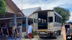 In this photo released by the San Sai District Administrative Office, journalists working for Democratic Voice of Burma, prepare to get into a van after being arrested at San Sai District in Chiang Mai province north of Thailand May 9, 2021.