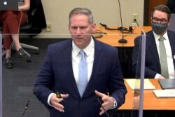 Prosecutor Steven Schleicher makes closing arguments as defense attorney Eric Nelson listens during the trial of former Minneapolis police officer Derek Chauvin for second-degree murder.