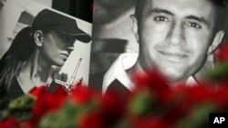 Photos of victims and floral tributes are left at the scene of the nightclub New Year's Day attack, in Istanbul, Jan. 3, 2017.