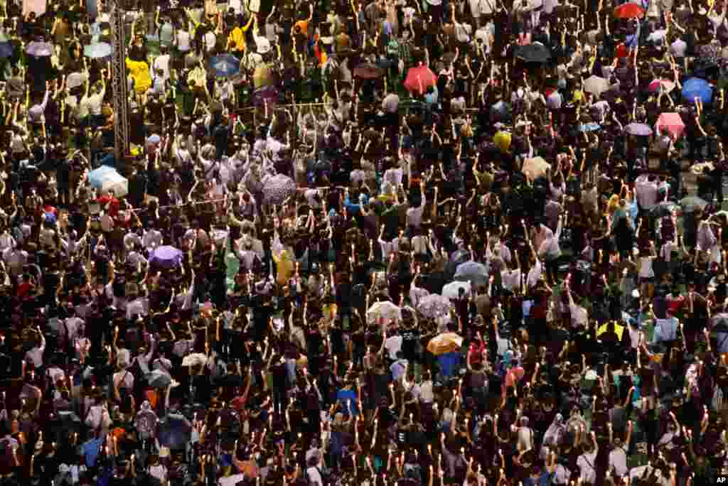 Tens of thousands of people attend a candlelight vigil at Victoria Park in Hong Kong, June 4, 2013.