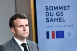 FILE - French President Macron reacts during a joint press conference with Niger's president in Paris, on July 9, 2021, following a video summit with leaders of G5 Sahel countries.