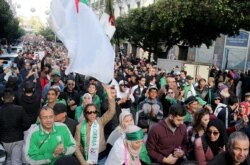 Demonstrators shout slogans during an anti-government rally in Algiers, Algeria December 27, 2019. REUTERS/Ramzi Boudina