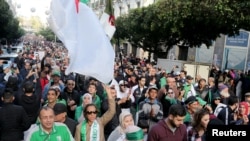 Demonstrators shout slogans during an anti-government rally in Algiers, Algeria, Dec. 27, 2019.
